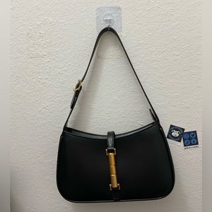 Black shoulder bag. Decent size.